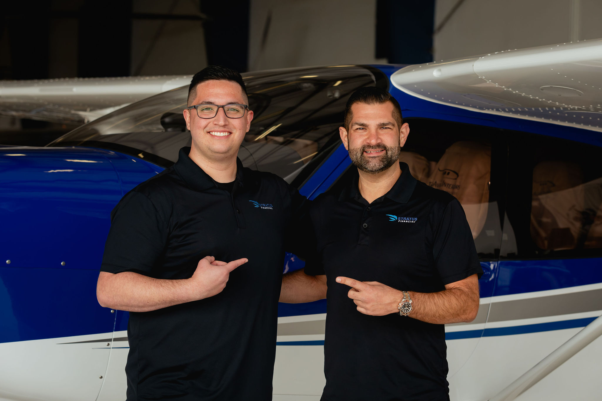 Brandon Martini and Carson Vasquez together in front of an aircraft